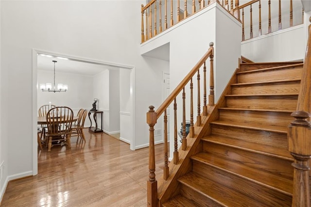 1418 Mill Path Loop, Lawrenceville, GA 30045 - stairway with wood finished floors and a high ceiling