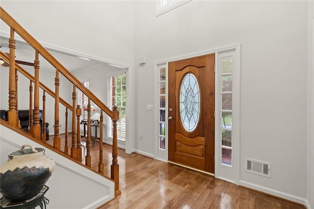 1418 Mill Path Loop, Lawrenceville, GA 30045 - entrance foyer with wood finished floors, stairs, and a towering ceiling