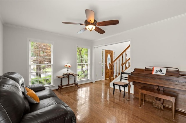 1418 Mill Path Loop, Lawrenceville, GA 30045 - living room featuring ornamental molding, stairs, wood finished floors, and a ceiling fan