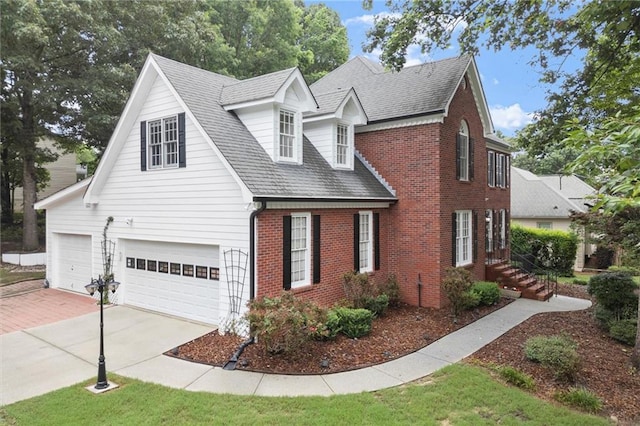 1418 Mill Path Loop, Lawrenceville, GA 30045 - view of front of house featuring brick siding, driveway, and a garage