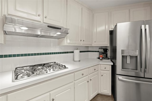 1418 Mill Path Loop, Lawrenceville, GA 30045 - kitchen featuring appliances with stainless steel finishes, under cabinet range hood, light countertops, and decorative backsplash