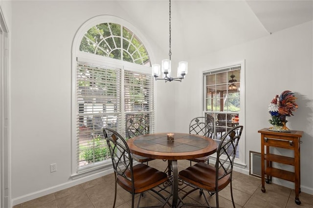 1418 Mill Path Loop, Lawrenceville, GA 30045 - dining area featuring healthy amount of natural light, a chandelier, light tile patterned floors, and vaulted ceiling