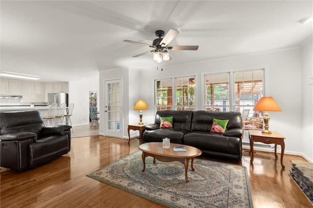 1418 Mill Path Loop, Lawrenceville, GA 30045 - living area with a ceiling fan, wood finished floors, and crown molding