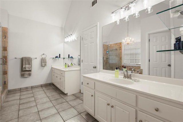 1418 Mill Path Loop, Lawrenceville, GA 30045 - full bath with a shower stall, two vanities, tile patterned flooring, a chandelier, and vaulted ceiling