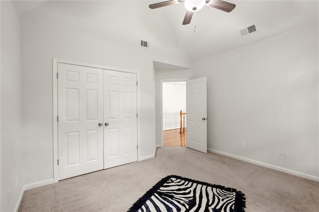 1418 Mill Path Loop, Lawrenceville, GA 30045 - unfurnished bedroom featuring carpet floors, lofted ceiling, a closet, and ceiling fan