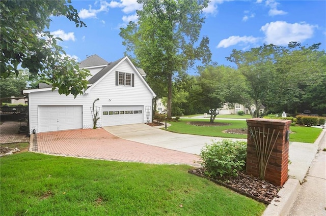 1418 Mill Path Loop, Lawrenceville, GA 30045 - view of side of property with driveway, a yard, and a garage