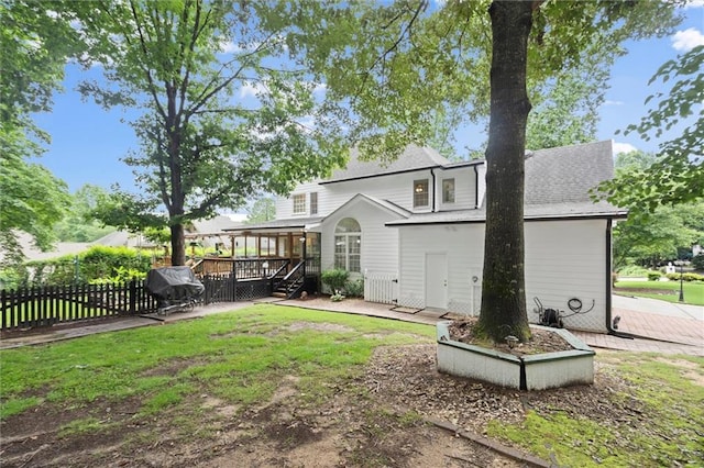 1418 Mill Path Loop, Lawrenceville, GA 30045 - back of house featuring a deck and a patio area