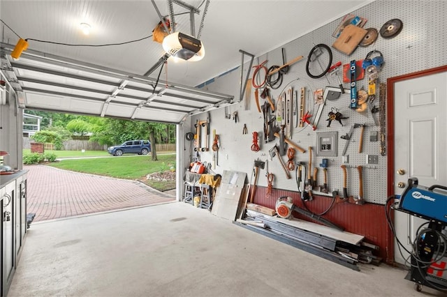 1418 Mill Path Loop, Lawrenceville, GA 30045 - garage featuring a garage door opener and a workshop area