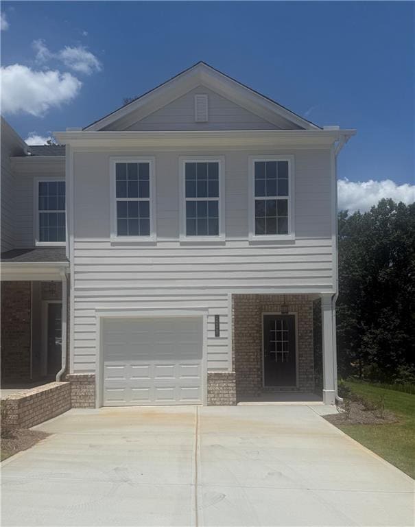 123 Greenview Ct Unit 1305, Homer, GA 30547 - view of front of home featuring brick siding, a garage, and concrete driveway