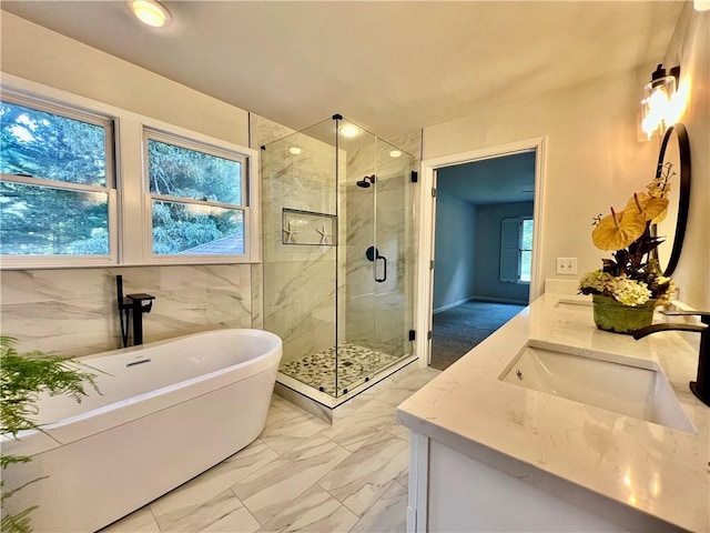 415 Wood Trace Ct, Alpharetta, GA 30022 - full bath featuring double vanity, a shower stall, a freestanding tub, and marble look tiles