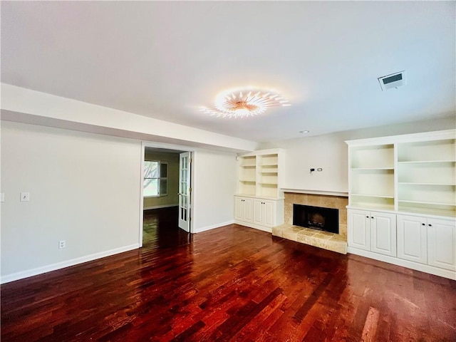 415 Wood Trace Ct, Alpharetta, GA 30022 - unfurnished living room featuring a tiled fireplace and wood finished floors