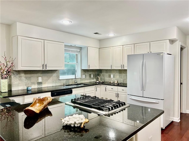 415 Wood Trace Ct, Alpharetta, GA 30022 - kitchen with freestanding refrigerator, white cabinets, decorative backsplash, and dark stone counters