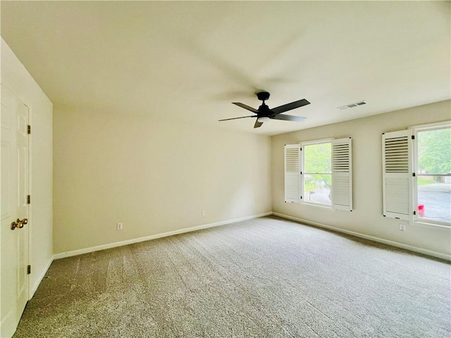 415 Wood Trace Ct, Alpharetta, GA 30022 - spare room featuring carpet, a ceiling fan, and healthy amount of natural light