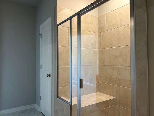 bathroom featuring an enclosed shower