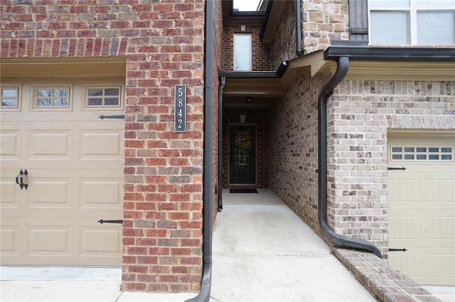 view of exterior entry featuring a garage