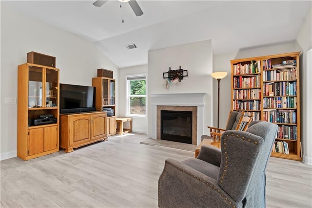 52 Lantern Trce, Hiram, GA 30141 - living room featuring ceiling fan, a premium fireplace, light wood-style flooring, baseboards, and visible vents