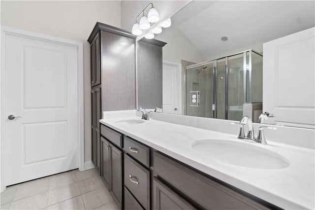 52 Lantern Trce, Hiram, GA 30141 - full bathroom with double vanity, a sink, lofted ceiling, and a stall shower