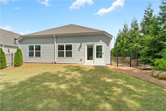 52 Lantern Trce, Hiram, GA 30141 - back of property with a lawn, fence, and a shingled roof