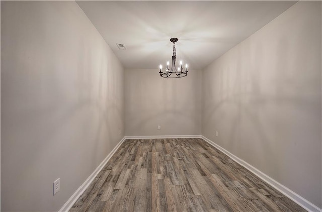 380 Inman Rd, Fayetteville, GA 30215 - unfurnished room featuring wood finished floors, a chandelier, and baseboards