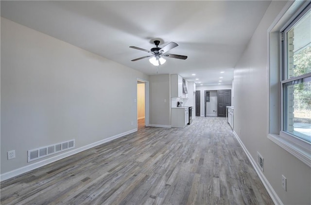 380 Inman Rd, Fayetteville, GA 30215 - unfurnished living room with light wood finished floors, ceiling fan, baseboards, healthy amount of natural light, and recessed lighting