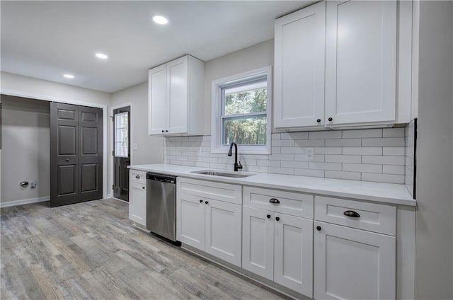 380 Inman Rd, Fayetteville, GA 30215 - kitchen with dishwasher, a sink, light countertops, light wood-style flooring, and recessed lighting
