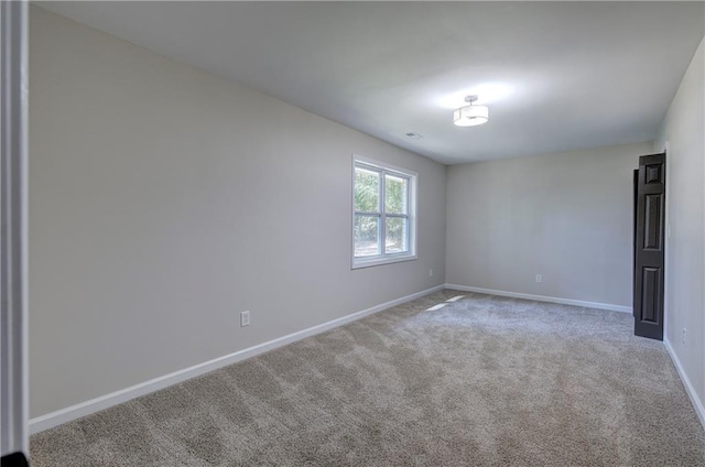 380 Inman Rd, Fayetteville, GA 30215 - spare room featuring baseboards and carpet floors