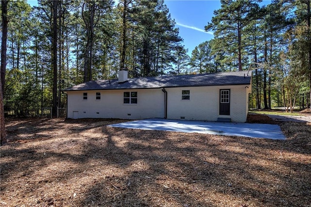 380 Inman Rd, Fayetteville, GA 30215 - rear view of house with a patio, a chimney, brick siding, and crawl space