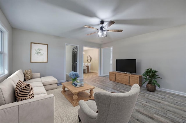 380 Inman Rd, Fayetteville, GA 30215 - living room with light wood-style floors, ceiling fan, and baseboards