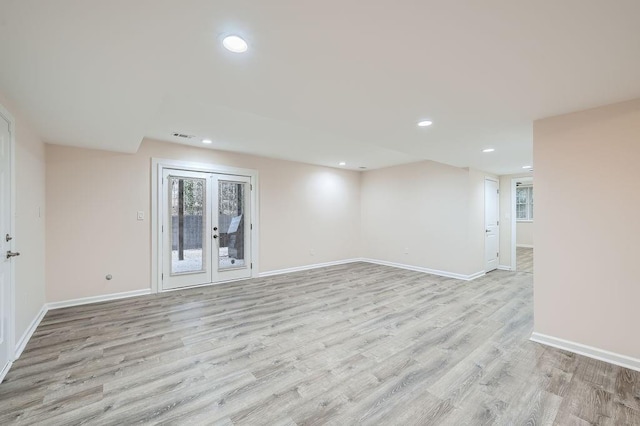 interior space with recessed lighting, french doors, baseboards, and light wood finished floors