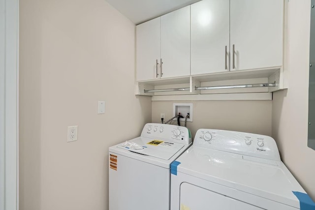 laundry room featuring cabinet space and washer and dryer