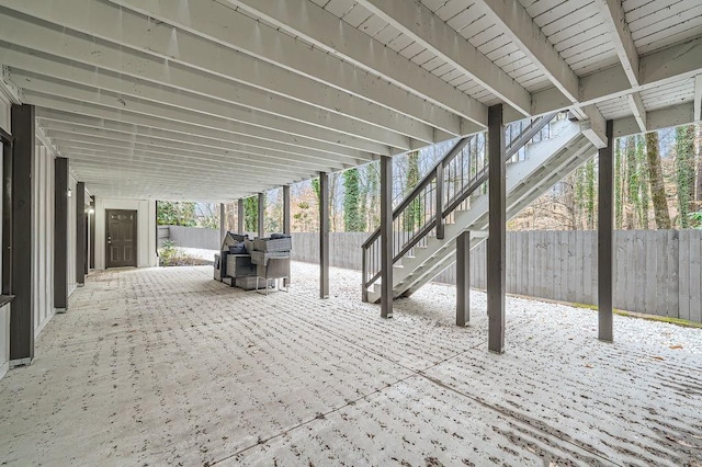 view of patio / terrace featuring a fenced backyard and stairs