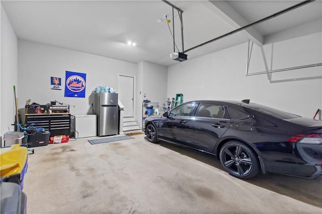216 Orchard Trl, Canton, GA 30115 - garage with freestanding refrigerator and a garage door opener
