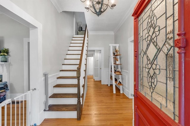 1238 Macland Rd, Dallas, GA 30132 - foyer entrance with light wood finished floors, crown molding, stairway, and a chandelier