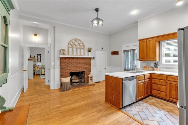 1238 Macland Rd, Dallas, GA 30132 - kitchen with stainless steel appliances, a peninsula, brown cabinetry, light countertops, and crown molding