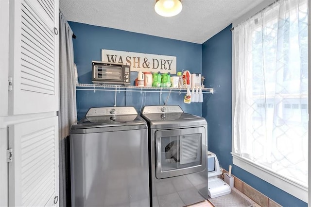 1238 Macland Rd, Dallas, GA 30132 - laundry room with independent washer and dryer, plenty of natural light, and a textured ceiling