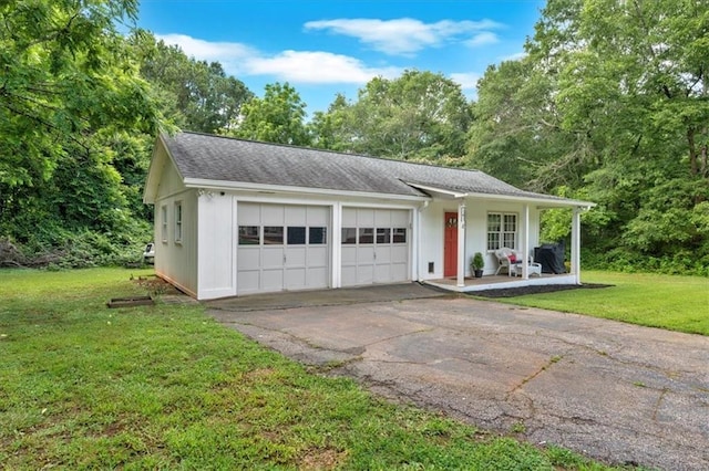 1238 Macland Rd, Dallas, GA 30132 - ranch-style home with a front yard, covered porch, a garage, roof with shingles, and asphalt driveway