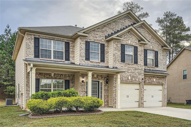 craftsman house with a front lawn, central AC, and a garage