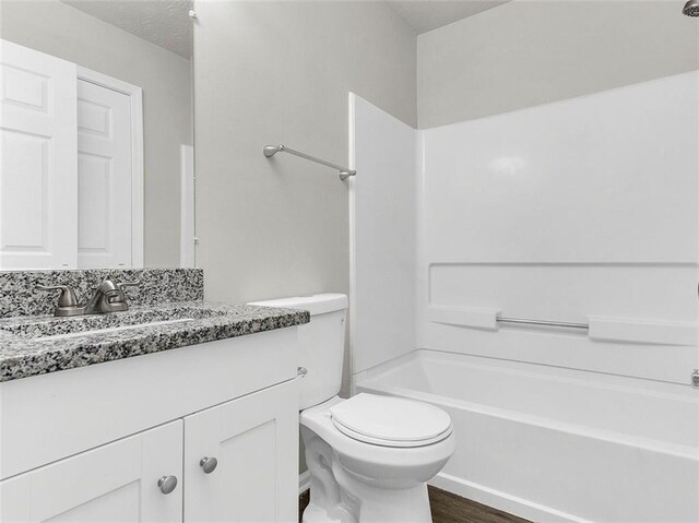 2146 Silva Ct, Conley, GA 30288 - full bathroom featuring toilet, vanity, wood finished floors, and bathtub / shower combination