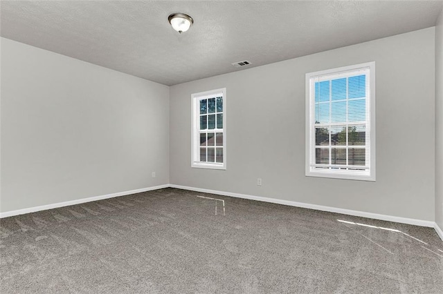 2146 Silva Ct, Conley, GA 30288 - empty room featuring carpet flooring, baseboards, and a textured ceiling