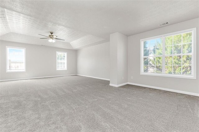 2146 Silva Ct, Conley, GA 30288 - unfurnished room featuring a textured ceiling, baseboards, a ceiling fan, and carpet floors