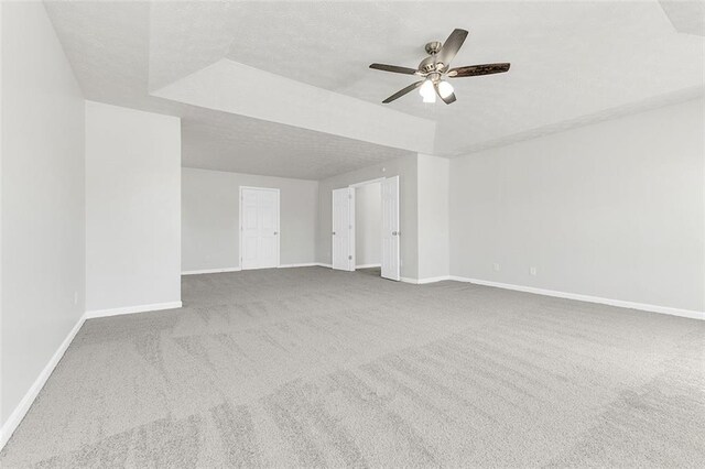 2146 Silva Ct, Conley, GA 30288 - spare room with a ceiling fan, carpet, baseboards, and a textured ceiling