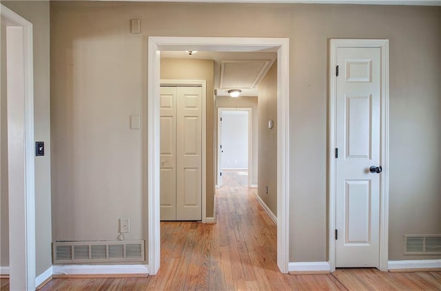 hall with light hardwood / wood-style floors