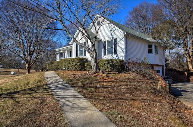 view of side of property featuring a garage