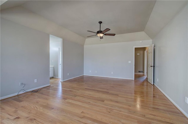 unfurnished room featuring ceiling fan, light wood-type flooring, and vaulted ceiling