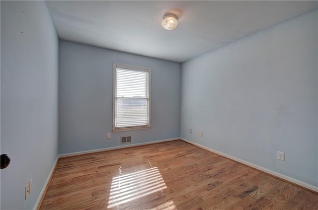 unfurnished room featuring light wood-type flooring