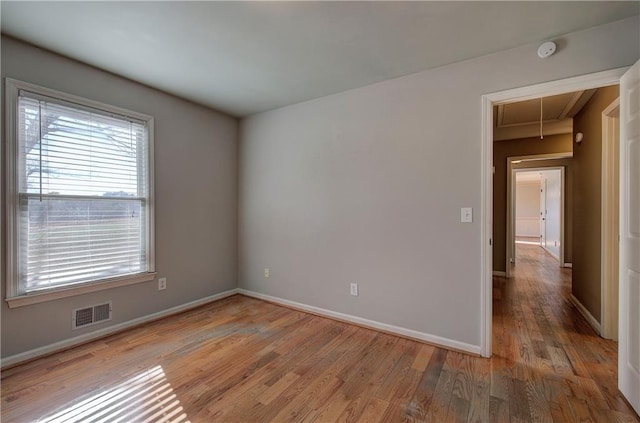 spare room featuring hardwood / wood-style flooring