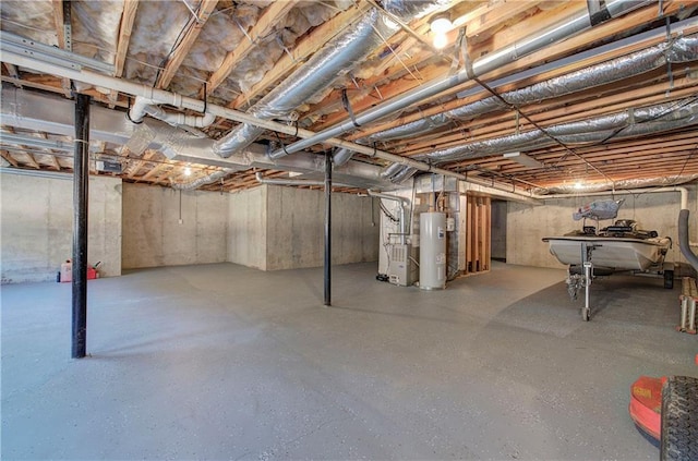 basement with water heater and heating unit