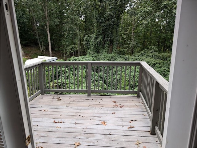 deck featuring a view of trees