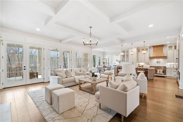 living area with beam ceiling, french doors, recessed lighting, and coffered ceiling