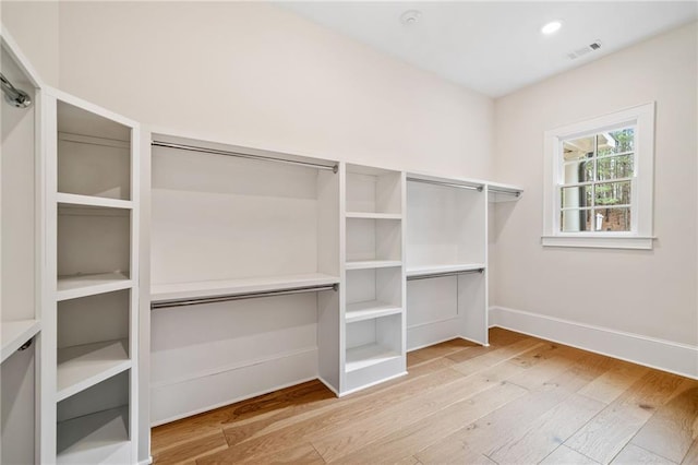 spacious closet with hardwood / wood-style floors and visible vents